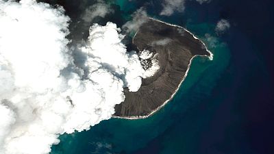 This satellite image provided by Maxar Technologies shows a view of Hunga Tonga Hunga Ha’apai volcano in Tonga, Jan. 18, 2022 after a huge undersea volcanic eruption.