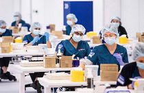 Technicians prepare Pfizer vaccines at Vaccination Centre in Sydney