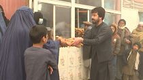 Desperate Afghans queue for free bread