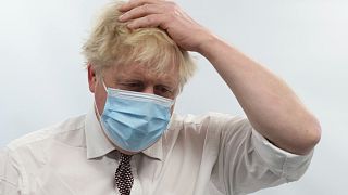 Britain's Prime Minister Boris Johnson gestures during a visit to Finchley Memorial Hospital, in North London, Jan. 18, 2022.