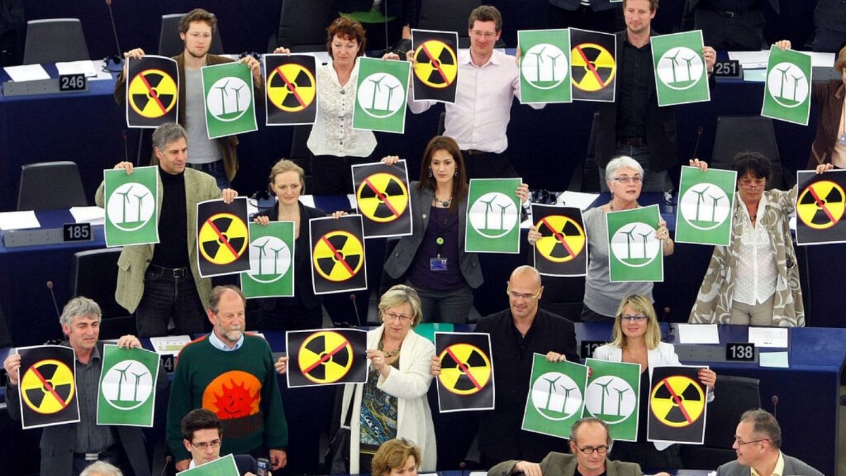 Green parties members of the European Parliament protest with anti-nuclear posters