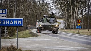 Members of Gotland's Regiment patrol in a tank, on a road in Visby, nothern Gotland, Sweden, Sunday Jan. 16 2022.
