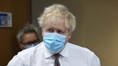 Britain's Prime Minister Boris Johnson looks on during a visit to Finchley Memorial Hospital, in North London, Tuesday, Jan. 18, 2022.