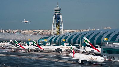 An Emirates jetliner comes in for landing at the Dubai International Airport in Dubai, United Arab Emirates.