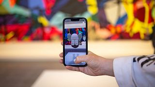 Augmented reality art designed by contemporary artist KAWS is on display at the Serpentine Galleries in London