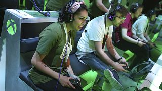 Gaming fans interact with newly-announced games at the Xbox E3 2019 Showcase in the Microsoft Theater at L.A. Live, Sunday, June 9, 2019 in Los Angeles.