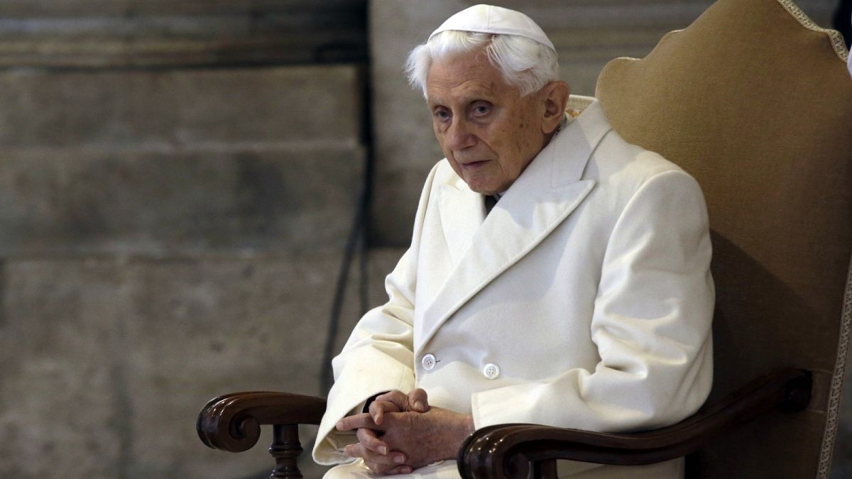 Pope Emeritus Benedict XVI sits in St. Peter's Basilica as he attends the ceremony marking the start of the Holy Year, at the Vatican, Dec. 8, 2015