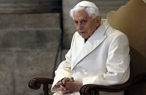 Pope Emeritus Benedict XVI sits in St. Peter's Basilica as he attends the ceremony marking the start of the Holy Year, at the Vatican, Dec. 8, 2015
