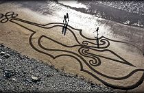 A giant sand artwork in tribute to Ashling Murphy, an Irish schoolteacher who was fatally attacked