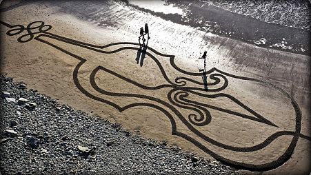 A giant sand artwork in tribute to Ashling Murphy, an Irish schoolteacher who was fatally attacked