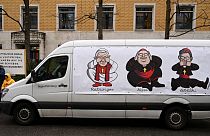 Katolik Dünyası'nın liderlerini eleştiren bir karikatür çizilmiş kamyonet