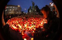 A girl lights a candle in remembrance of Czech statesman Vaclav Havel, who peacefully brought down communism in Czechoslovakia. He died on Dec 18, 2011. He was 75.