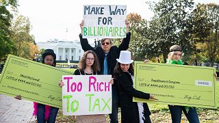 Satirical "corporations and the wealthy" protest outside the White House, on Thursday, Nov. 4, 2021, in Washington.