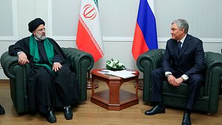 Iranian President Ebrahim Raisi, left, and Russian State Duma speaker Vyacheslav Volodin talk to each other during their meeting in Moscow, Russia, Thursday, Jan. 20, 2022.