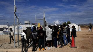 Migrants wait to be registered inside Pournara migrant reception center in Kokkinotrimithia outside the capital Nicosia, Cyprus