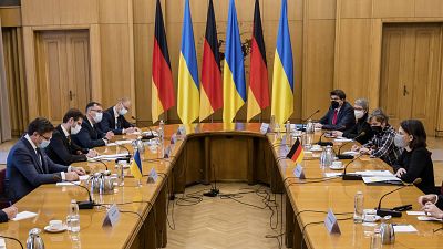 Ukrainian Foreign Minister Dmytro Kuleba, left, and German Foreign Minister Annalena Baerbock, right, attend talks in Kyiv, Ukraine, Monday, Jan. 17, 2022.