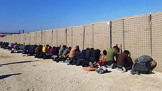 IS group fighters, arrested by the Kurdish-led Syrian Democratic Forces after they attacked Gweiran Prison, in Hassakeh, northeast Syria, Friday, Jan. 21, 2022.