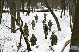 Members of Ukraine's Territorial Defense Forces, volunteer military units of the Armed Forces, train in a city park in Kyiv, Saturday, January 2022