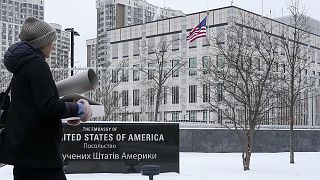 A woman walks past the U.S. Embassy in Kyiv