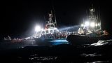 The migrants were located on a packed wooden boat off the coast of the Italian island of Lampedusa.