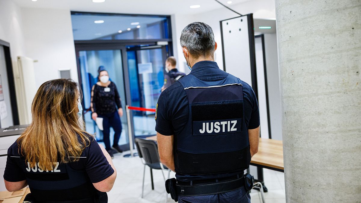 Justice officers secure access to the high-security area at the District Court Halle in Halle, on January 25, 2022, before the start of the trial against Leonora M.