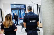 Justice officers secure access to the high-security area at the District Court Halle in Halle, on January 25, 2022, before the start of the trial against Leonora M.