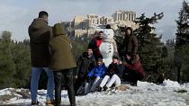 Athens residents enjoy snowy day on the foothills of the Acropolis
