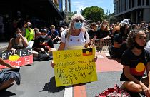 Protesters take part in an "Invasion Day" demonstration on Australia Day in Sydney on January 26, 2022.