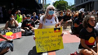 Protesters take part in an "Invasion Day" demonstration on Australia Day in Sydney on January 26, 2022.