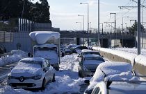 Stranded vehicles have been covered with snow for three days along the Attiki Odos road in Athens.