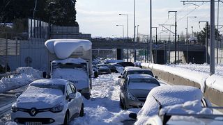 Stranded vehicles have been covered with snow for three days along the Attiki Odos road in Athens.