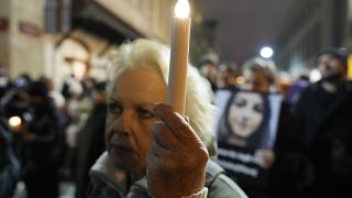 People gather before Poland's Constitutional Tribunal in Warsaw, Poland, on Saturday, Nov. 6, 2021, to protest restrictive abortion law that critics say led to a recent death 