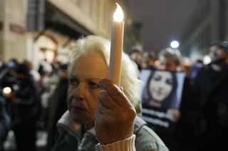 People gather before Poland's Constitutional Tribunal in Warsaw, Poland, on Saturday, Nov. 6, 2021, to protest restrictive abortion law that critics say led to a recent death