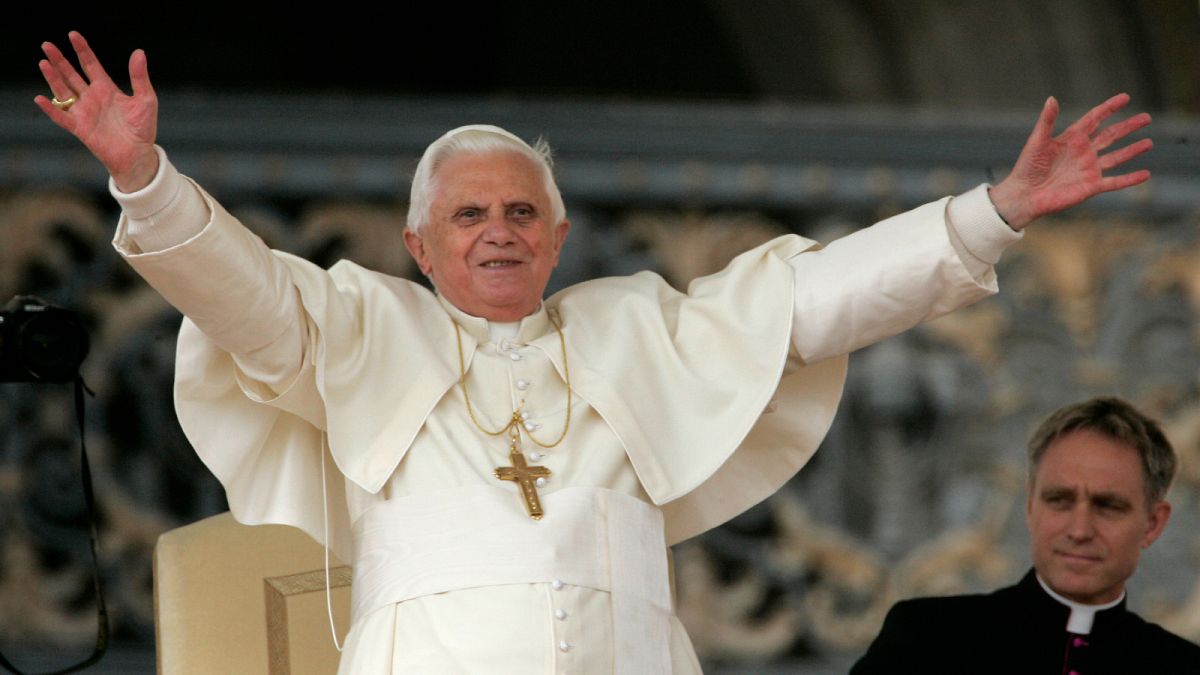 Pope Benedict XVI acknowledges cheers from faithful and pilgrims during the weekly general audience in St. Peter's square at the Vatican, Wednesday, Oct.24, 2007.