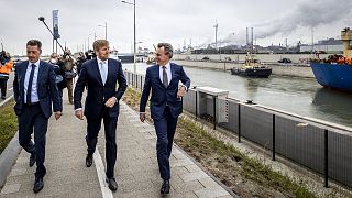 Netherlands' King Willem-Alexander (C) arrives to attend the opening and inauguration of the IJmuiden Sea Lock in Ijmuiden on January 26, 2022.