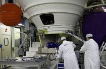 Technicians work on an Ariane 5 rocket engine northwest of Paris.