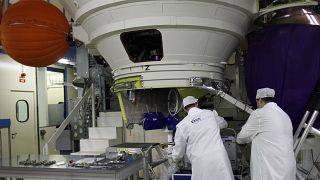 Technicians work on an Ariane 5 rocket engine northwest of Paris.