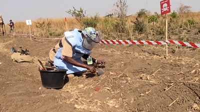  United Nations Mine Action Service (UNMAS) staff looking for landmines durig a demonstration.