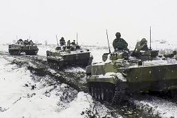 In this handout photo provided on Jan. 26, 2022, Russian military vehicles move during a military exercising at a training ground in Rostov region, Russia.