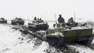 In this handout photo provided on Jan. 26, 2022, Russian military vehicles move during a military exercising at a training ground in Rostov region, Russia.