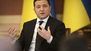 In this handout photo provided by the Ukrainian Presidential Press Office, Ukrainian President Volodymyr Zelenskyy speaks during a news conference in Kyiv, Jan. 28, 2022.