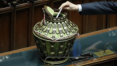 A lawmaker casts his vote in the Italian parliament during the seventh round of voting for Italy's 13th president A lawmaker casts his vote in the Italian parliament during the seventh round of voting for Italy's 13th president