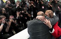 Omid Nouripour, newly elected party's co-chairman, is hugged by his wife Melanie Schnatsmeyer during a virtual party convention of the German Greens in Berlin