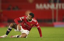 Manchester United's Mason Greenwood gets to his feet during the English League Cup soccer match between Manchester United and West Ham