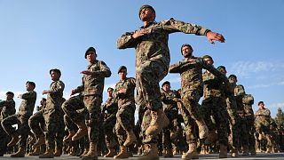 Newly graduated Afghan National Army personnel march during their graduation ceremony at the Afghan Military Academy in Kabul, Afghanistan. November 2020.