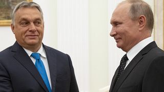 Hungarian Prime Minister Viktor Orban, left, and Russian President Vladimir Putin greet each other during their meeting in the Kremlin in Moscow, Russia, Tuesday, Sept. 18, 20