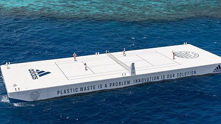 The floating tennis court is made from recycled plastics and an existing boat.