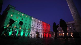 Television crew stand in front of Palazzo Chigi government's headquarters in January.