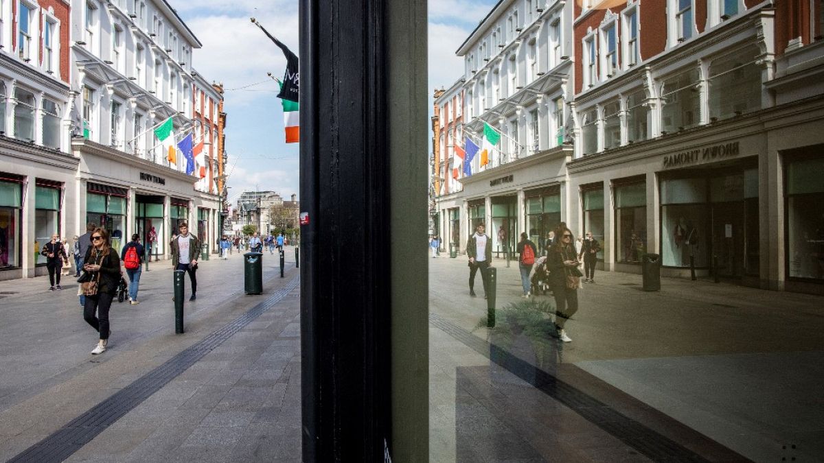 People walk along an empty Grafton Street in Dublin