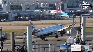 A British Airways plane attempts to land in high winds.